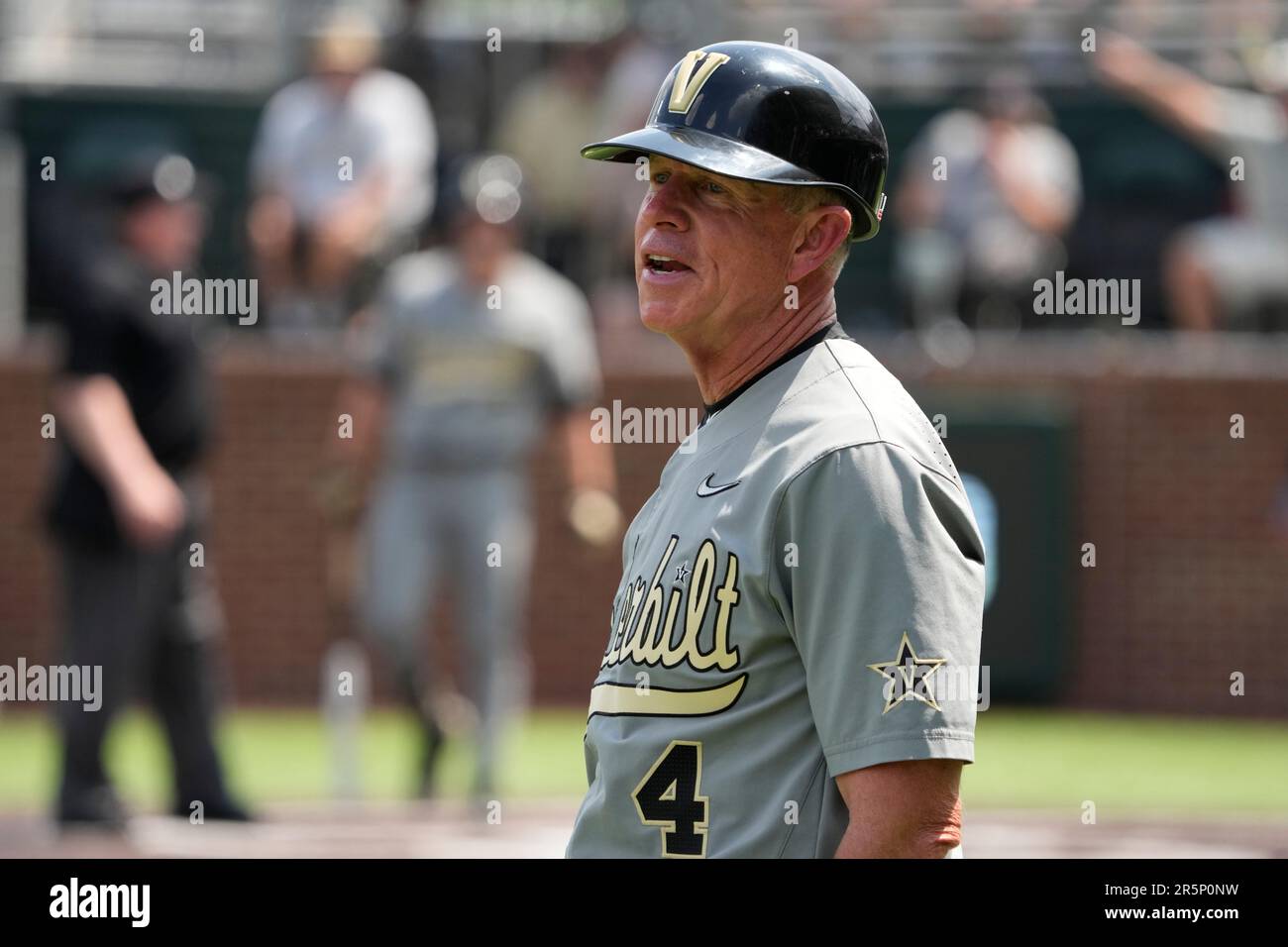 Vanderbilt head coach Tim Corbin talks to an umpire during an NCAA