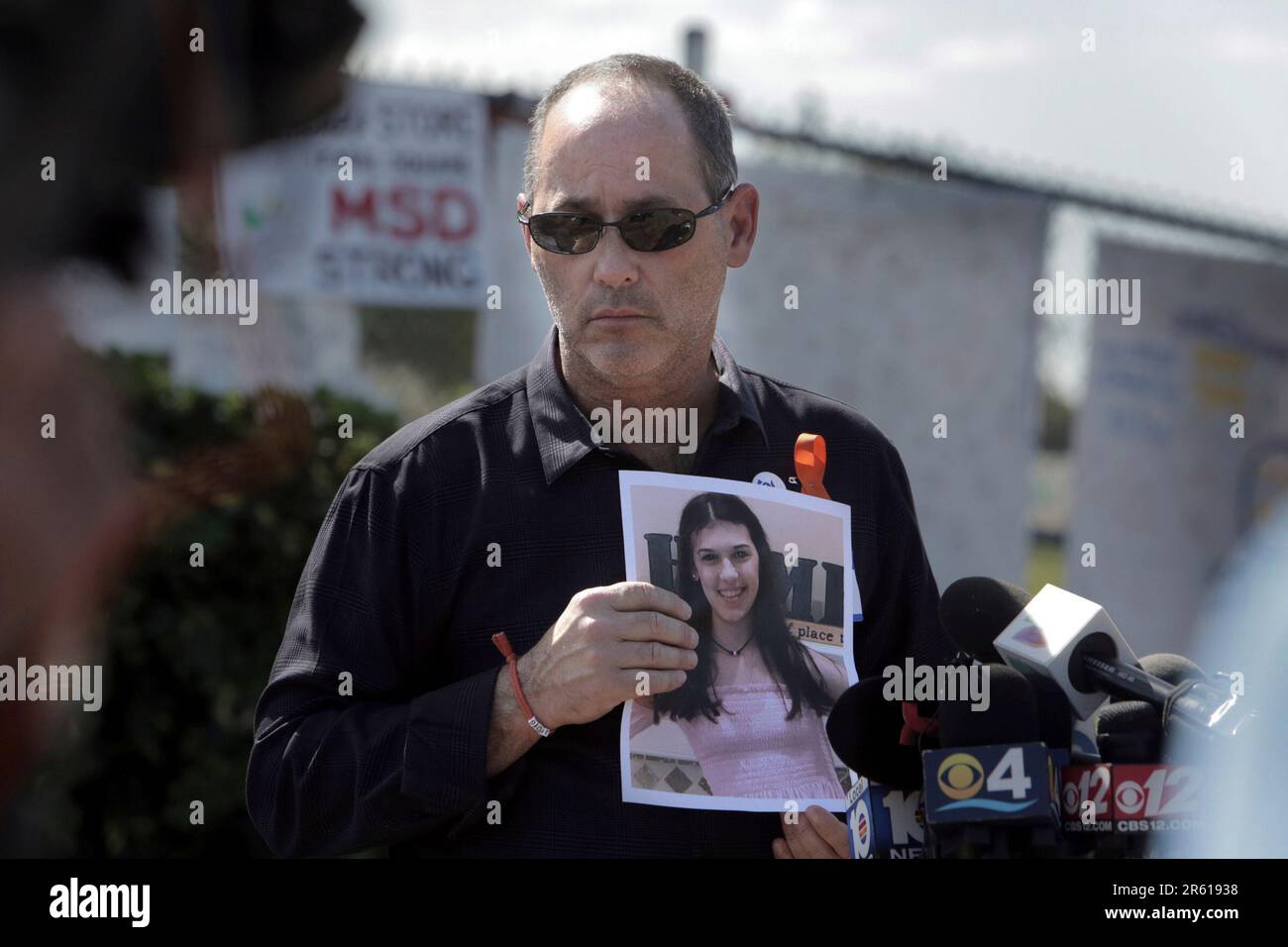 FILE Fred Guttenberg, father of Jaime Guttenberg, holds a picture of