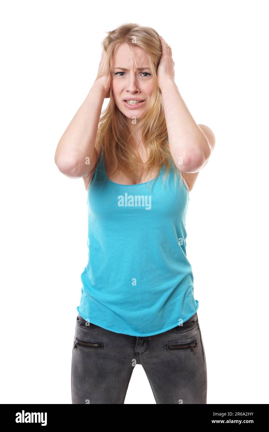 Young woman holding a dévasté sa tête dans l'agonie Banque D'Images
