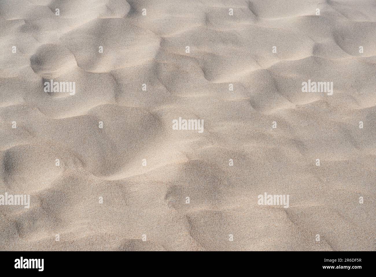 Texture d'une plage ou d'un désert de sable avec motifs vagues Banque D'Images