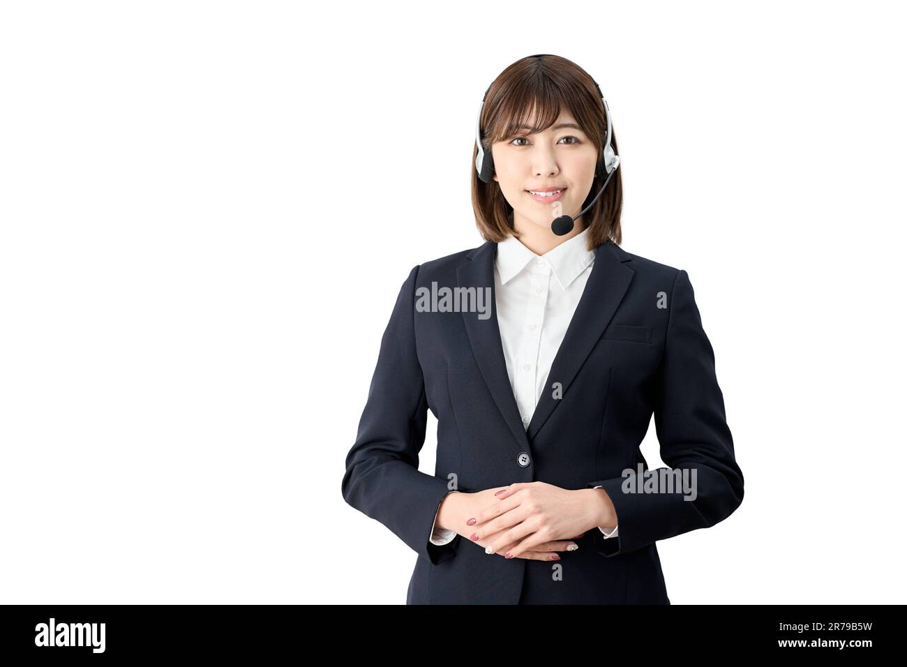 Opérateur téléphonique asiatique debout avec casque allumé Banque D'Images