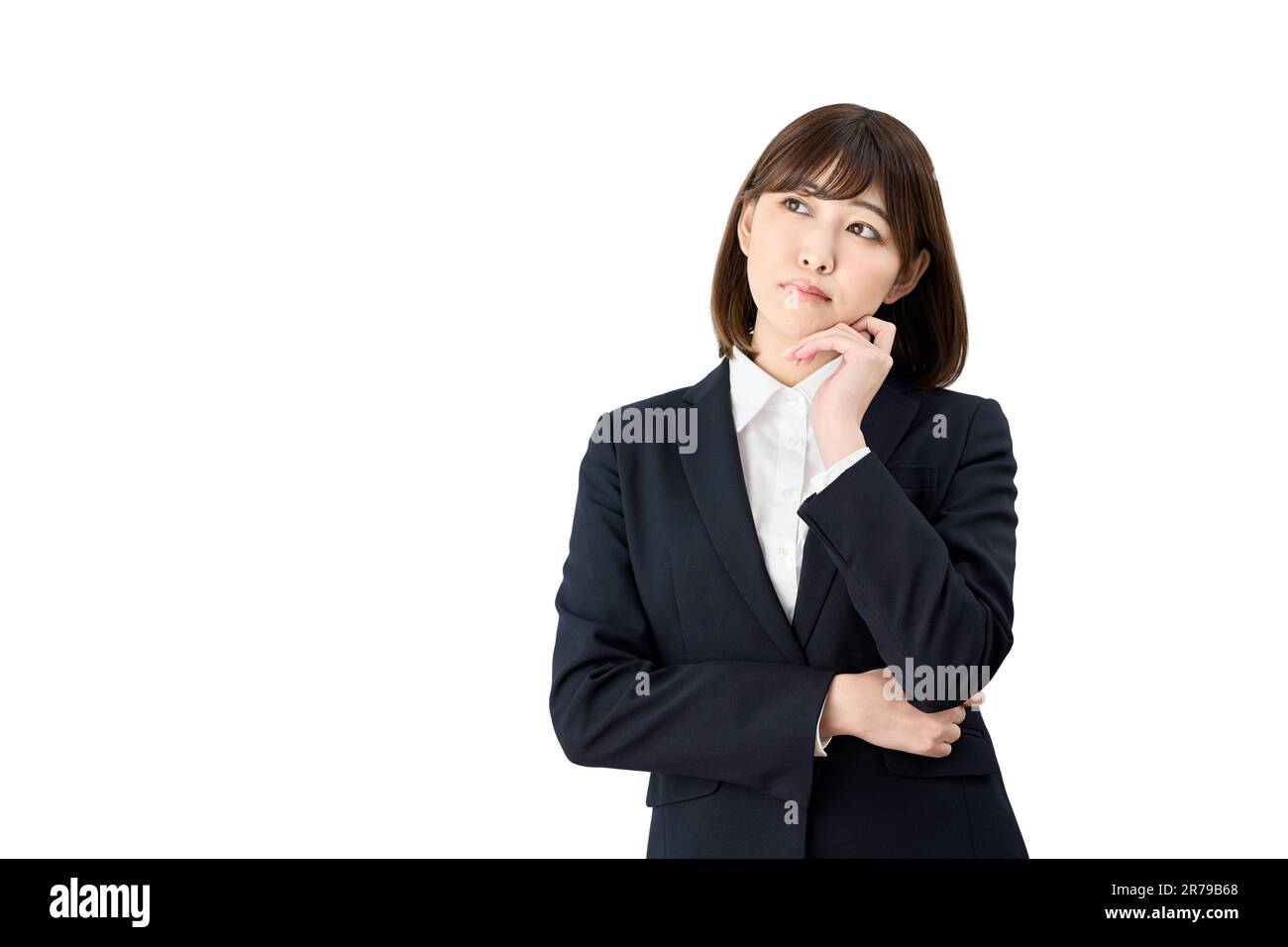 Femme d'affaires asiatique pensant avec sa main sur son menton Banque D'Images