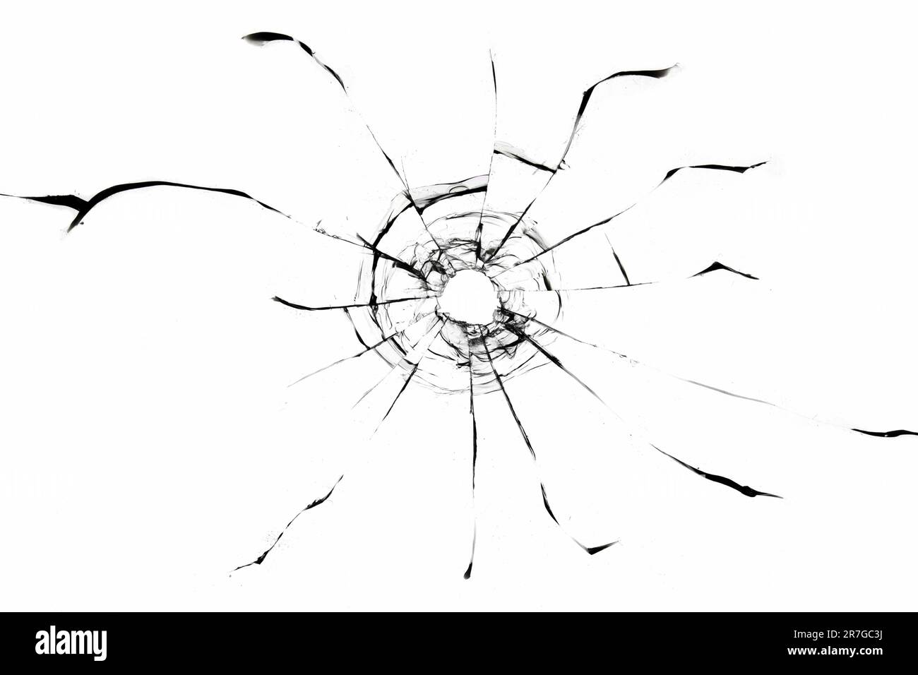 Texture des fissures de verre d'un coup de pistolet. Trou de balle dans la fenêtre, texture isolée sur fond blanc. Banque D'Images