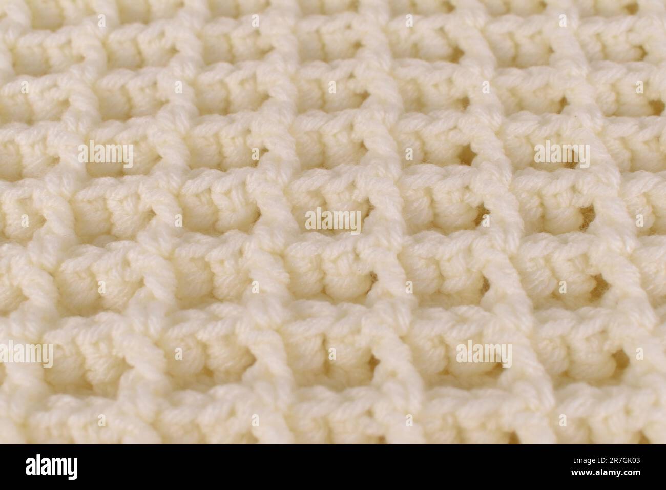 Motif gaufré blanc cassé à motif de couverture en crochet Banque D'Images