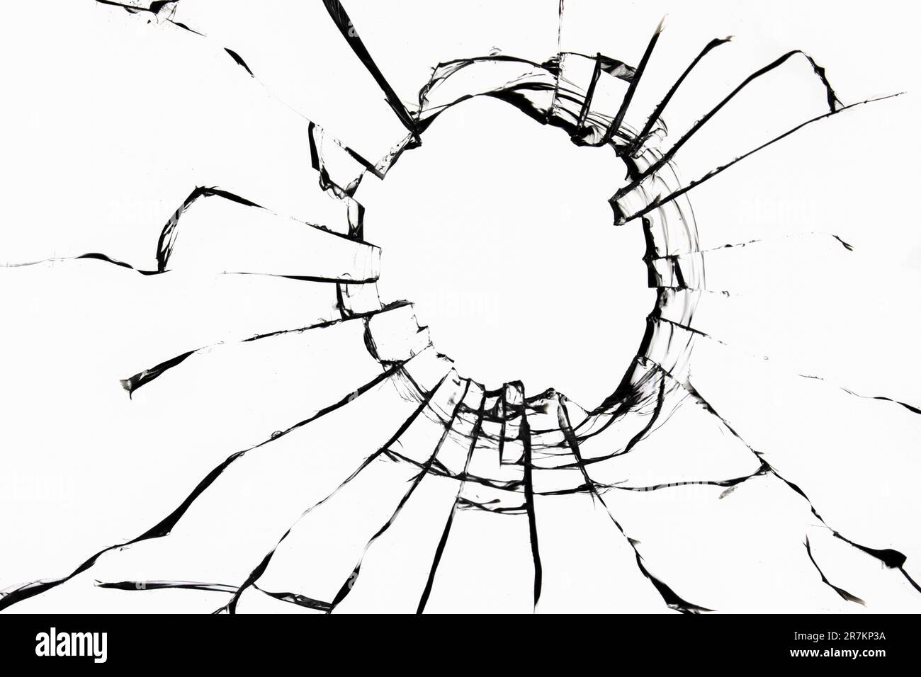 Texture des fissures avec un trou dans le verre sur un fond blanc. Effet de fenêtre cassée. Photo pour une utilisation dans la conception. Banque D'Images