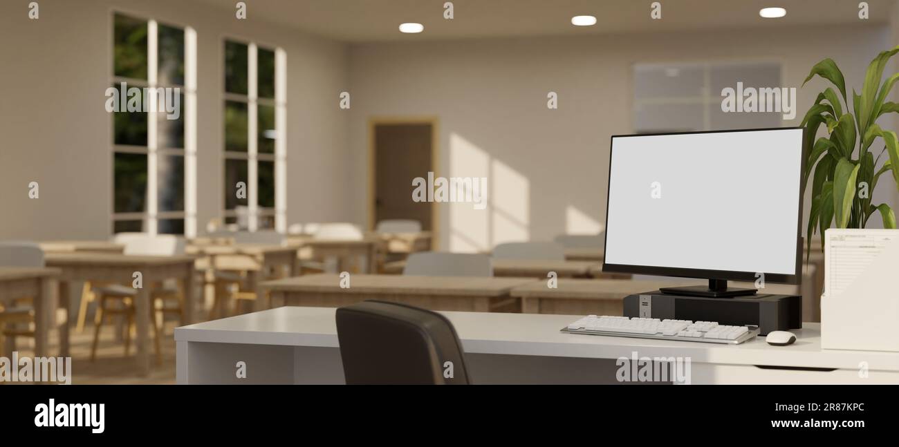 Un écran blanc d'ordinateur se présente sur un bureau dans une salle de classe moderne et minimaliste. bureau pour enseignants dans une salle de classe. rendu 3d, illustration 3d Banque D'Images