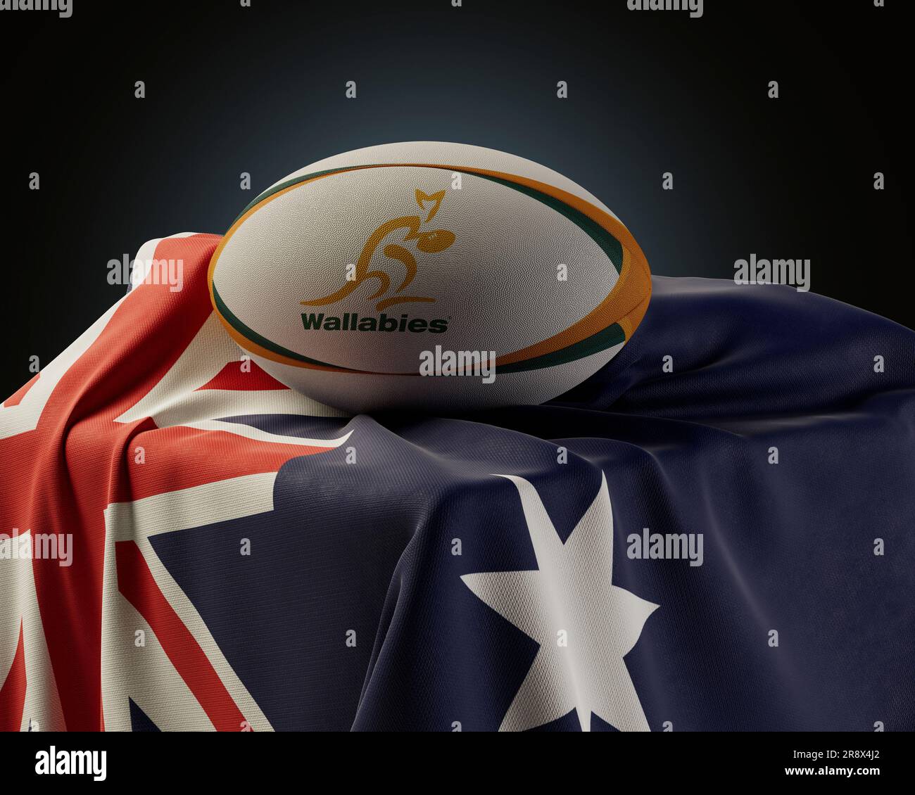 Un rendu en 3D d'une balle de rugby générique portant le logo de rugby de Wallabies reposant sur un drapeau national australien drapé - 4 décembre 2022 à Bristol Banque D'Images