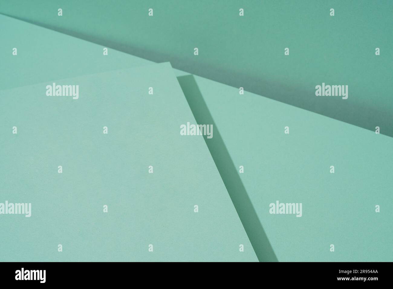 Arrière-plan coloré de papier vert avec ombre. Abstrait géométrique Banque D'Images