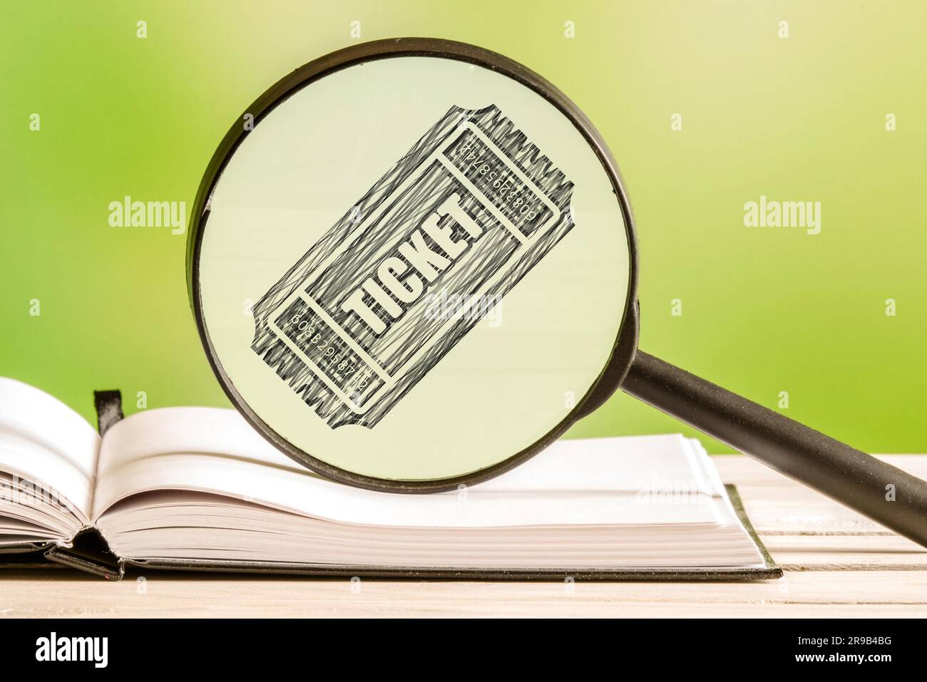 Recherche de ticket avec un dessin au crayon d'une icône ticket dans une loupe Banque D'Images