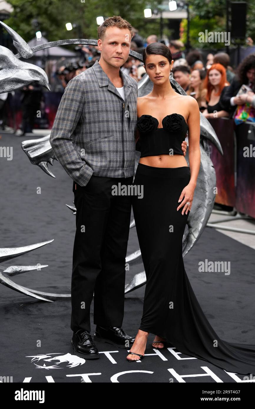 Josh Dylan, left, and Anya Chalotra pose for photographers upon arrival at the World premiere for the third season of 'The Witcher' on Wednesday, June 28, 2023 in London. (Scott Garfitt/Invision/AP) Banque D'Images