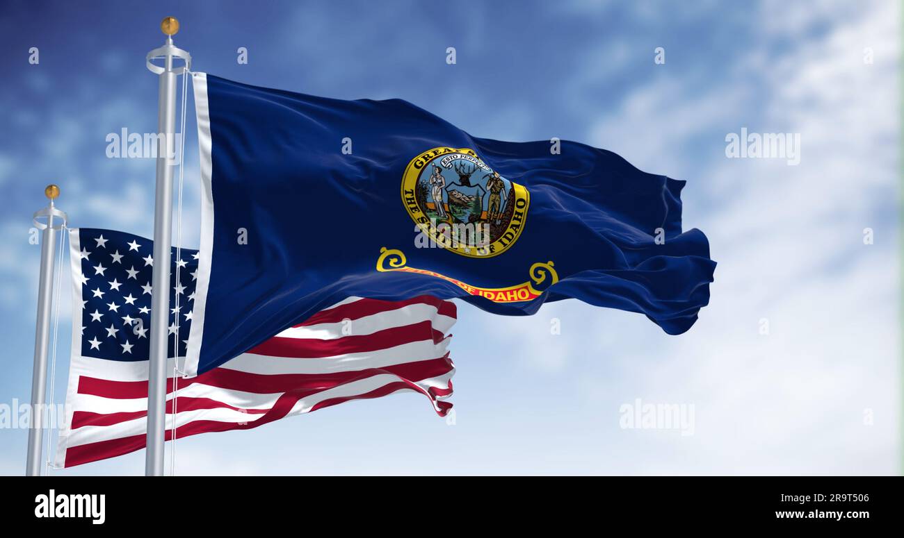 Le drapeau de l'État de l'Idaho agitant avec le drapeau national des États-Unis d'Amérique par temps clair. Rendu d'illustration 3D. Tissu ondulé Banque D'Images