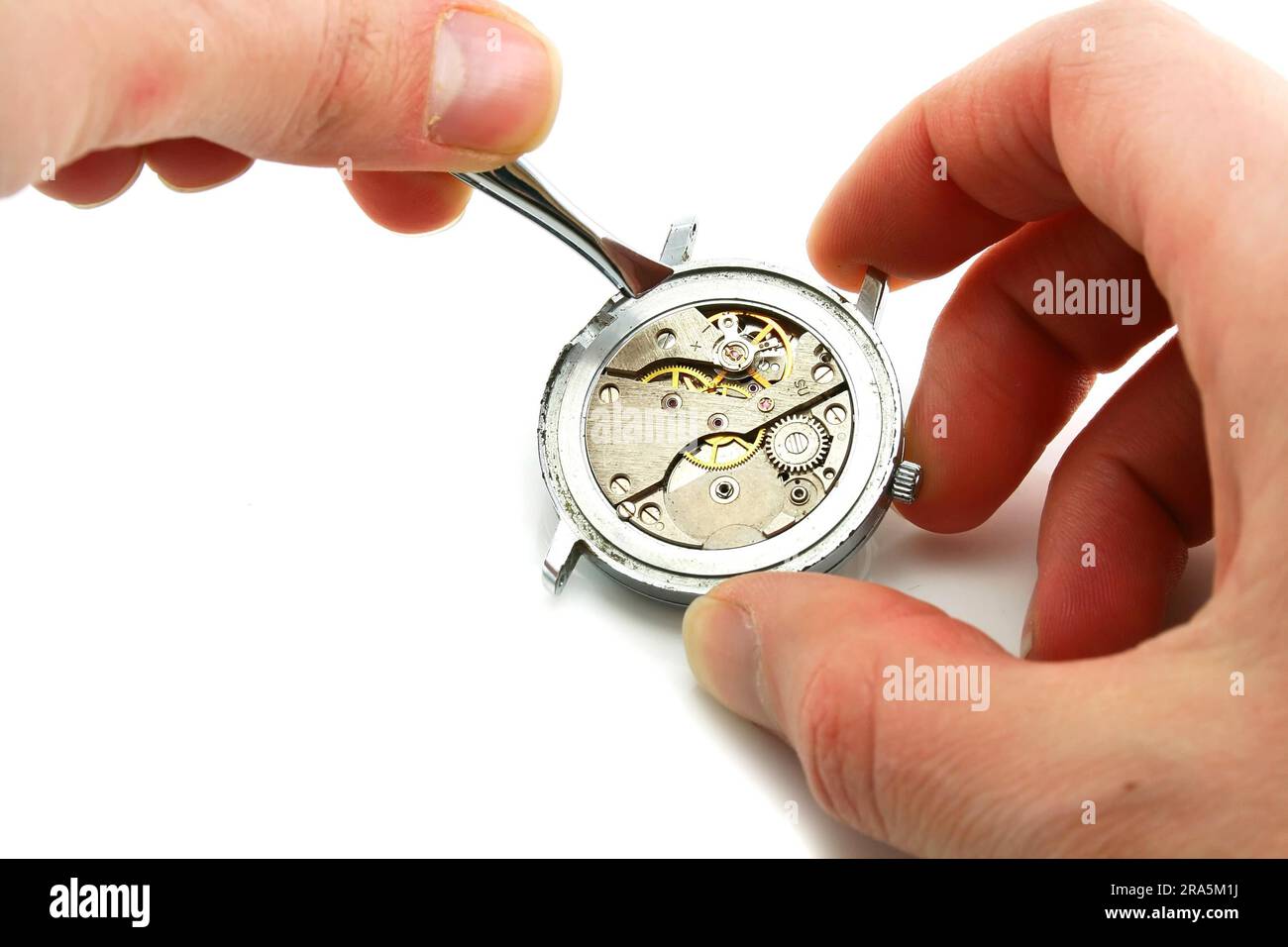Maintenance de l'horloge isolée sur un fond blanc Banque D'Images