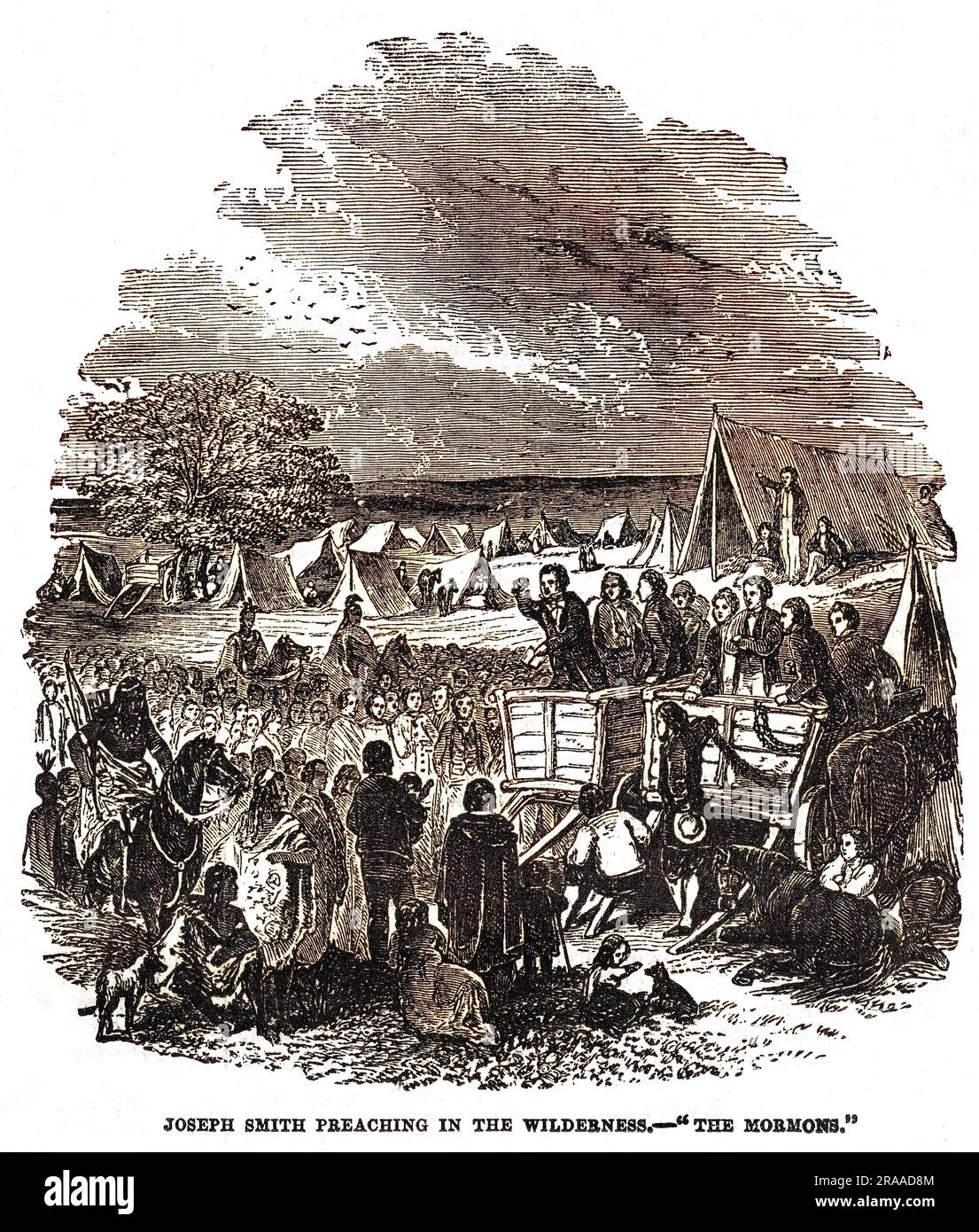 Joseph Smith(1805-1844), chef religieux américain et fondateur du Mormonisme, prêchant d'une charrette ouverte à ses disciples campés dans le désert. Banque D'Images