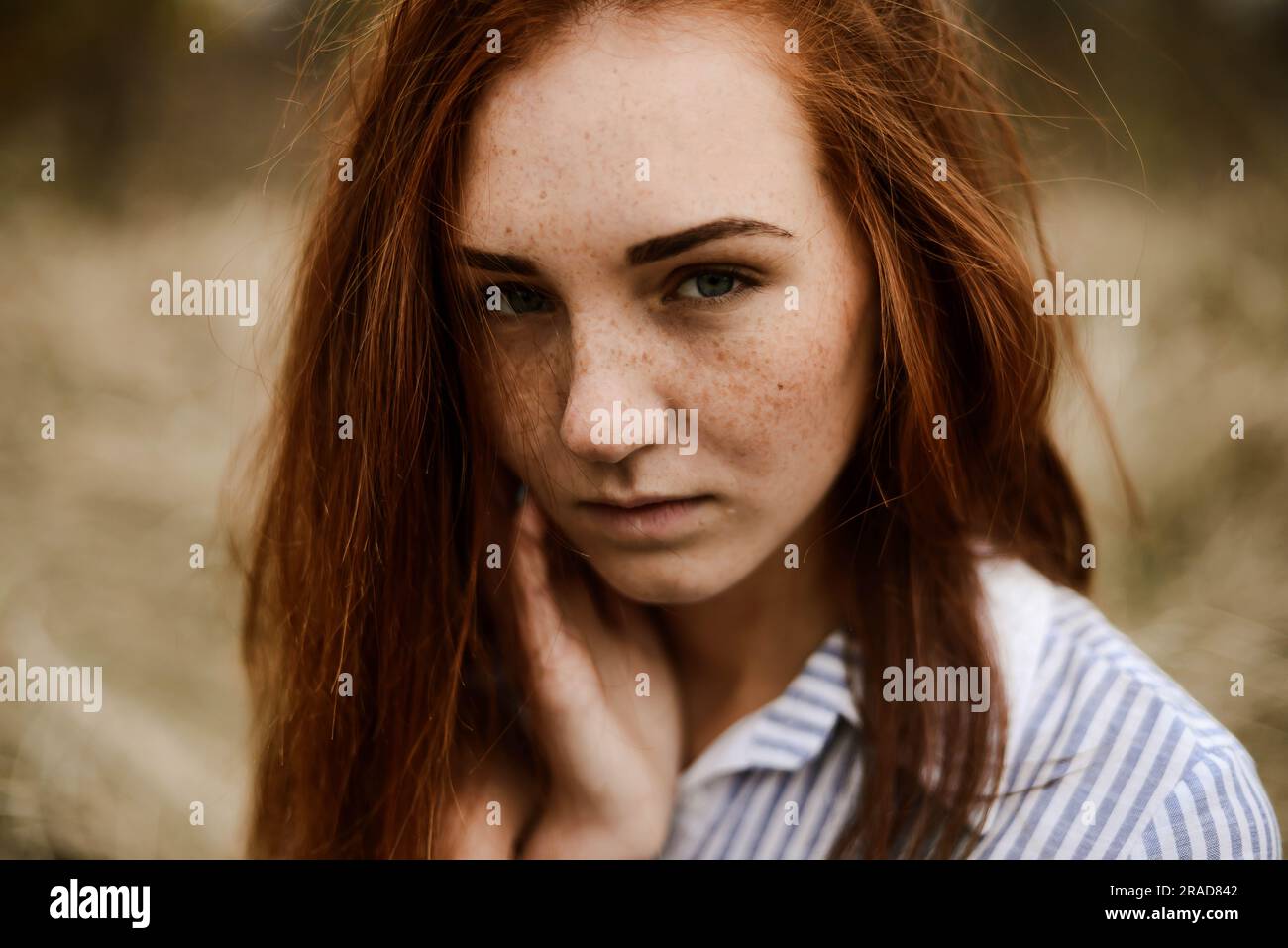Close-up portrait of teenage girl with red head Banque D'Images