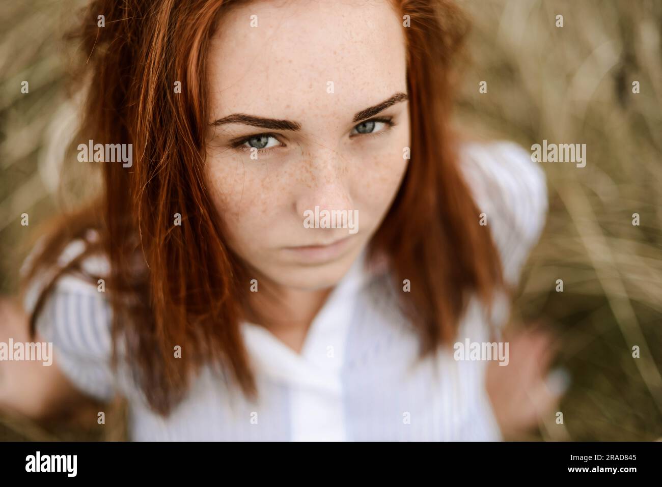 Close-up portrait of teenage girl with red head Banque D'Images