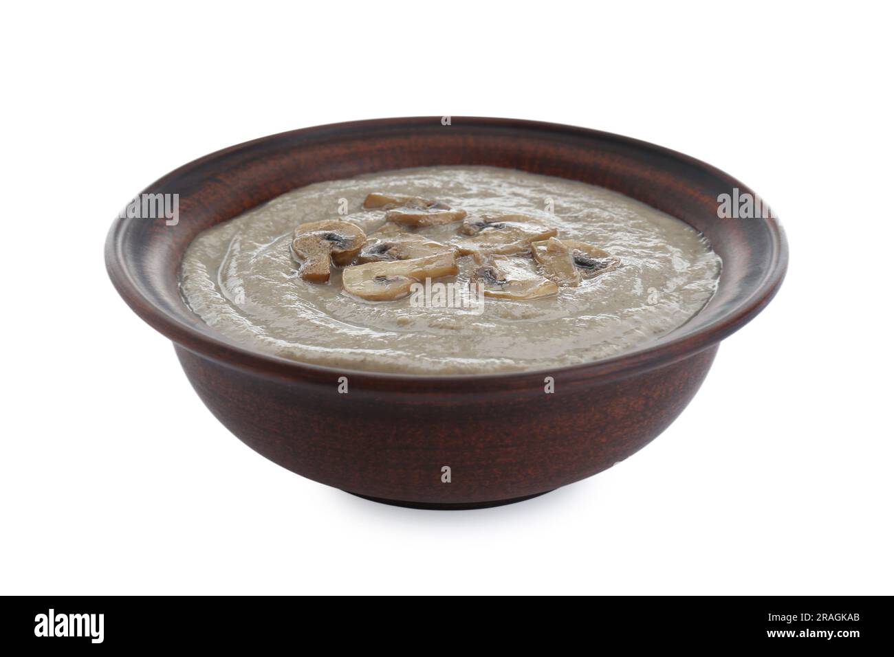 Délicieuse soupe à la crème de champignons sur fond blanc Banque D'Images
