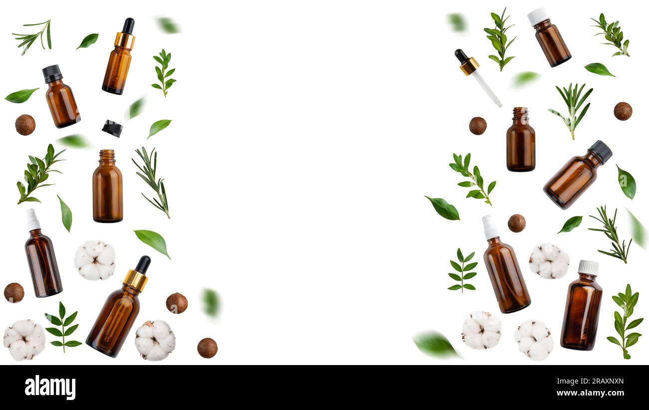 Compte-gouttes et vaporisateurs noix de macadamia fleurs de coton et herbes isolées sur fond blanc vue de pose plate avec espace de copie Banque D'Images