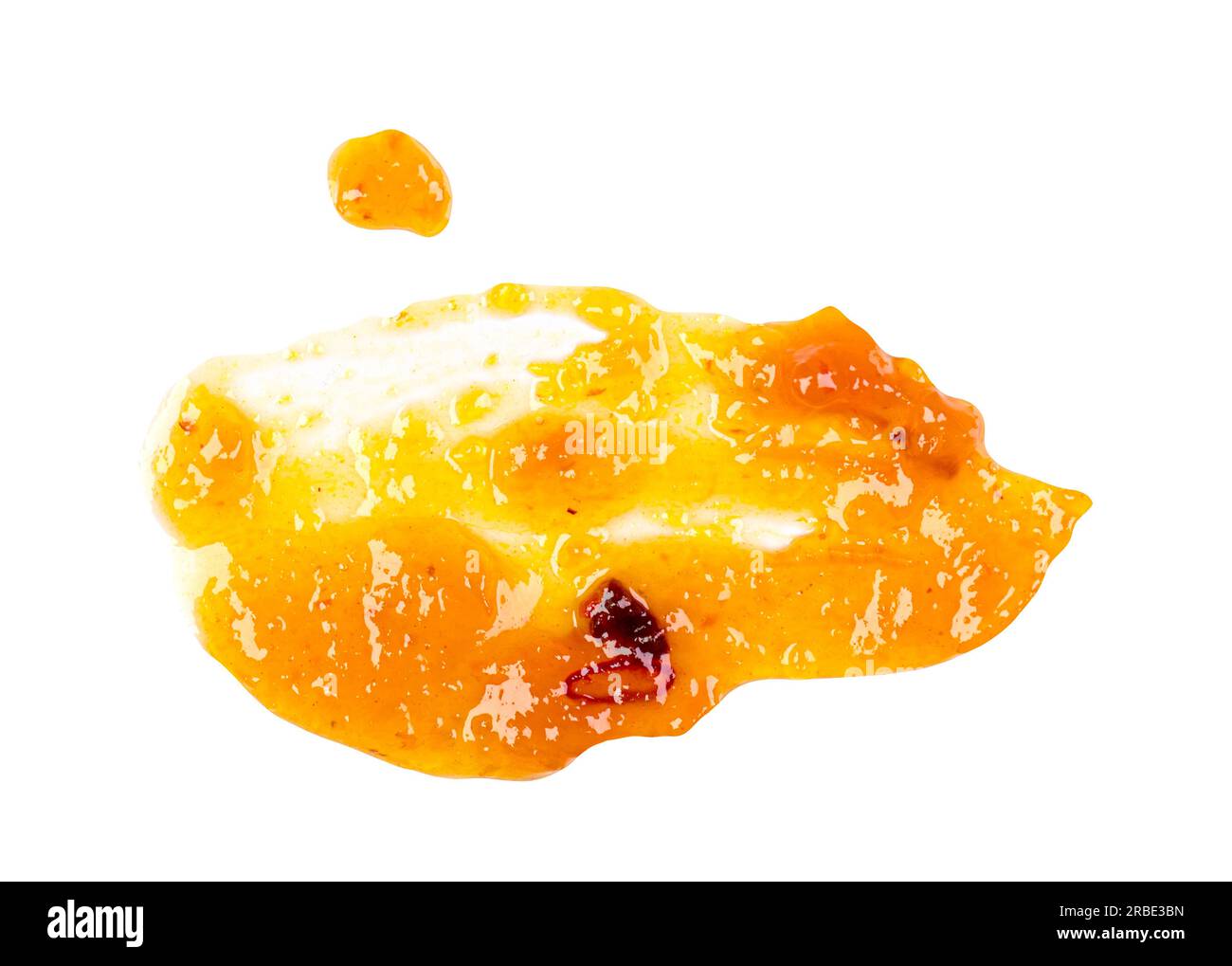 Frottis abstrait de sauce à la mangue jaune, confiture isolée sur blanc, vue de dessus Banque D'Images