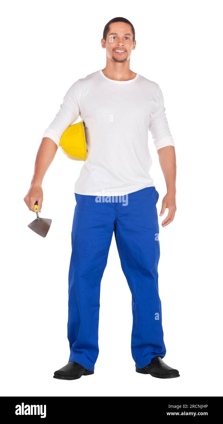 ouvrier africain de la construction en vêtements de travail , portant un casque de dur, tenant une truelle de brique isolée sur blanc Banque D'Images