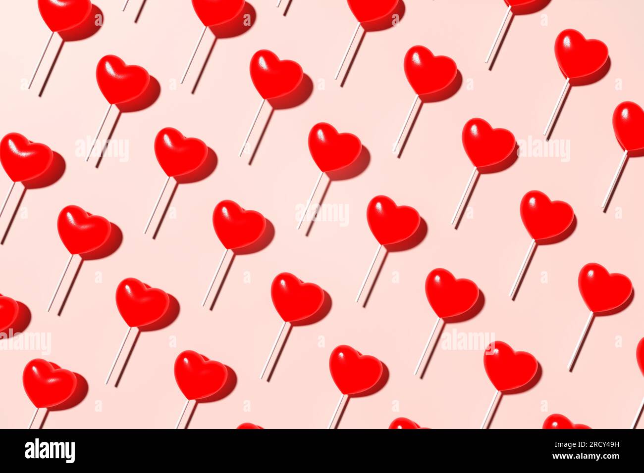 Motif sans couture rouge Lollypop en forme de coeur sur fond rose. Vue de dessus. Rendu 3D. Banque D'Images