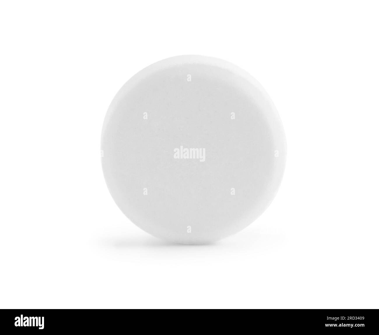 Une pilule ronde sur fond blanc. Traitement médical Banque D'Images