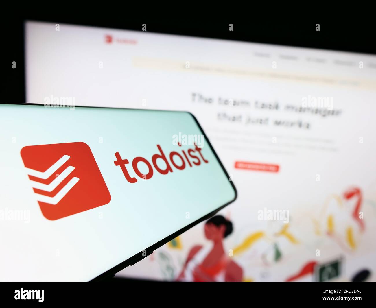 Téléphone mobile avec logo de la société américaine de gestion des tâches Todoist (Doist Inc.) sur l'écran devant le site Web. Concentrez-vous sur le centre gauche de l'écran du téléphone. Banque D'Images