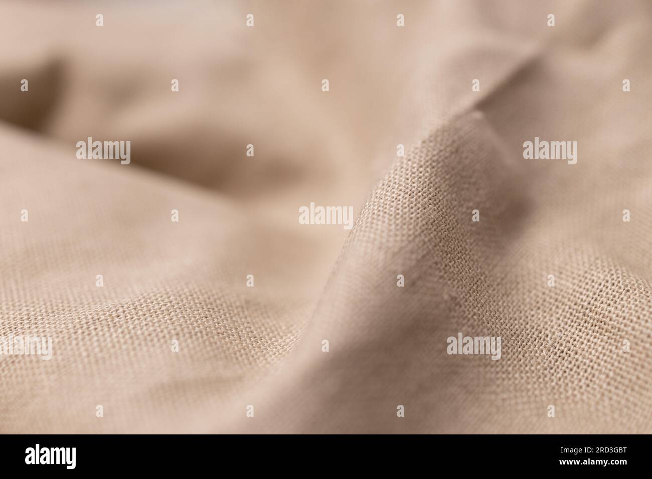 Texture naturelle du tissu de lin. Arrière-plan en toile de fond rugueux et froissé. Mise au point sélective Banque D'Images