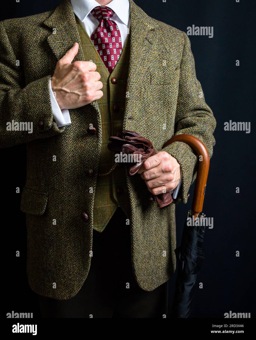 Portrait de Man in Tweed suit tenant un parapluie. Style vintage et mode rétro de Gentleman anglais. Banque D'Images