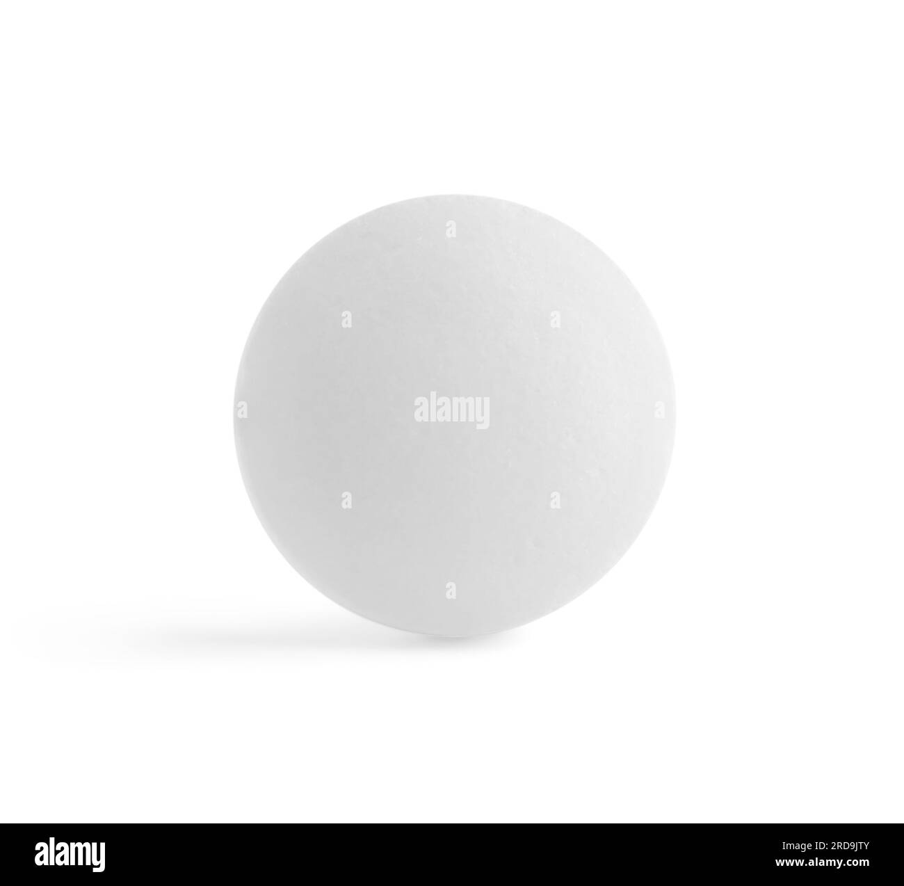 Une pilule ronde sur fond blanc. Traitement médical Banque D'Images