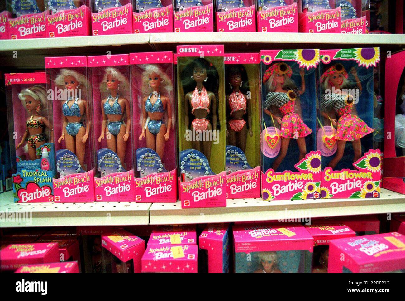 FILE - Barbie dolls line the shelves at a toy store in Torrance, Calif ...