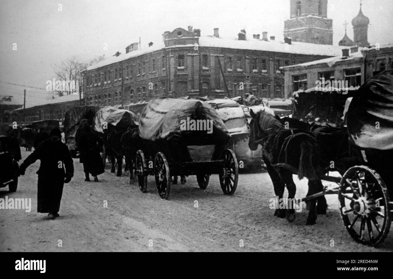 Wagon tiré par des chevaux dans une rue de Borovsk sur la ligne de front à l'extérieur de Moscou. Photo : Kroll. [traduction automatique] Banque D'Images