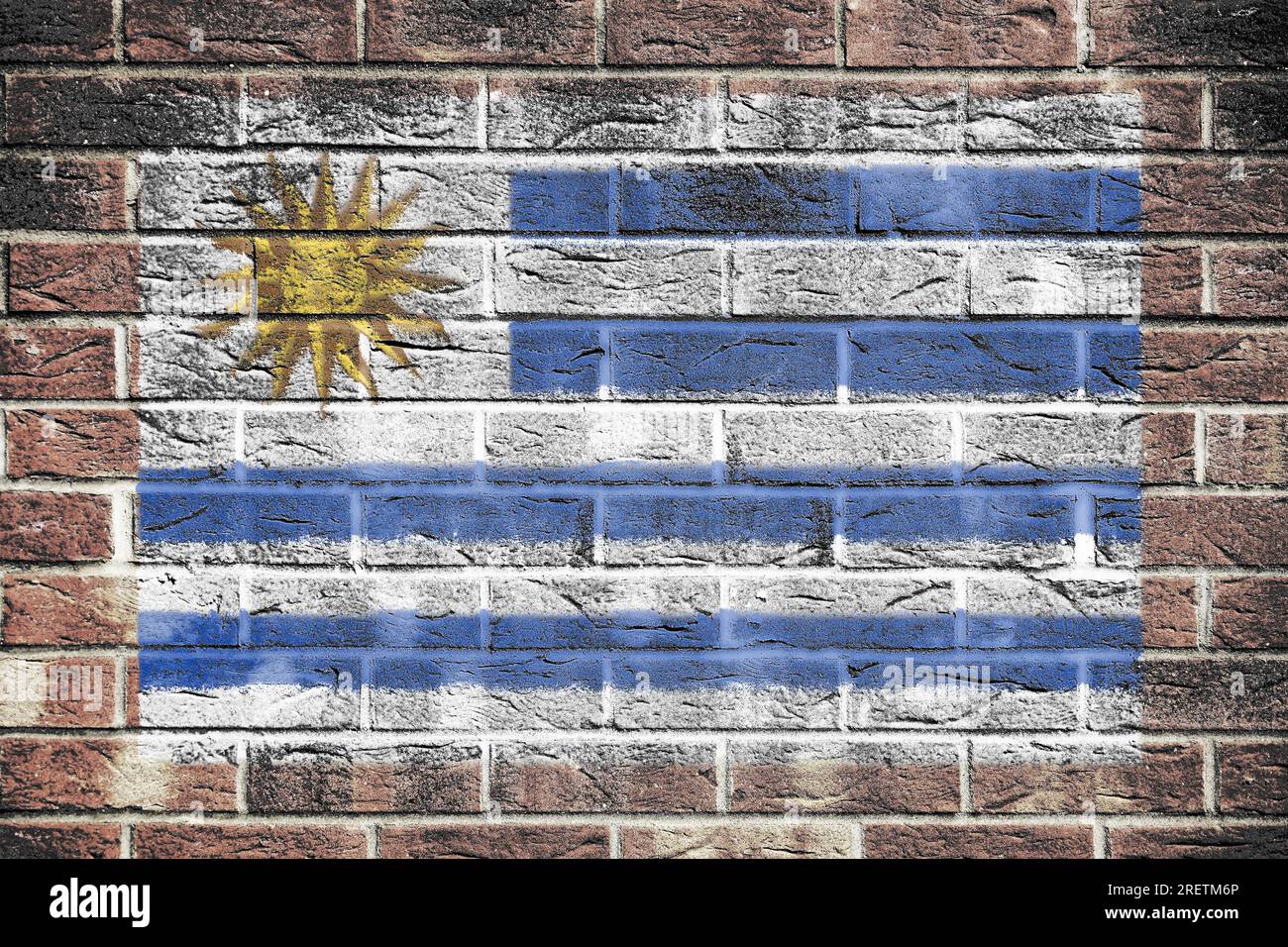 Drapeau Uruguay sur un fond de mur de briques Banque D'Images