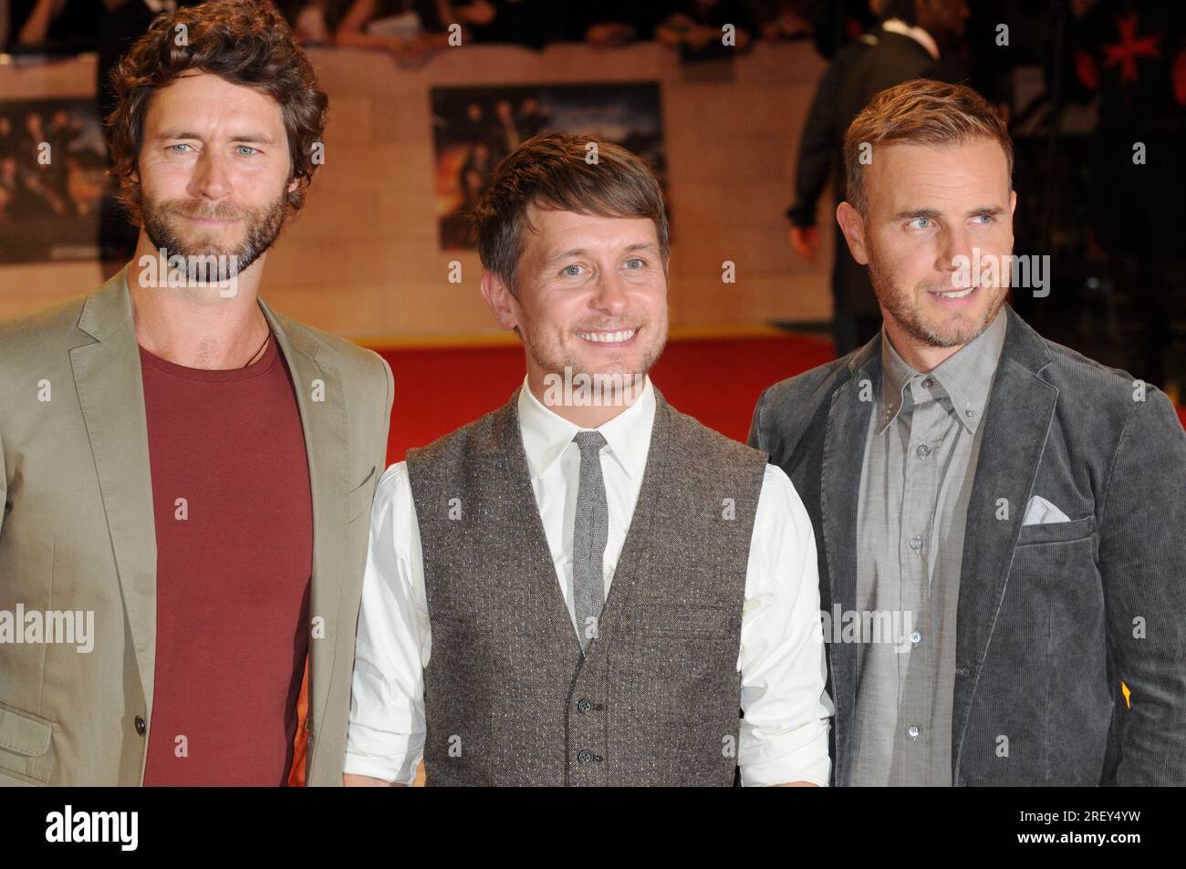"Prends ça", Donald Howard, Mark Owen, Gary Barlow. Première mondiale de « Three Musketeers in 3D », vue Westfield, Londres, Royaume-Uni Banque D'Images