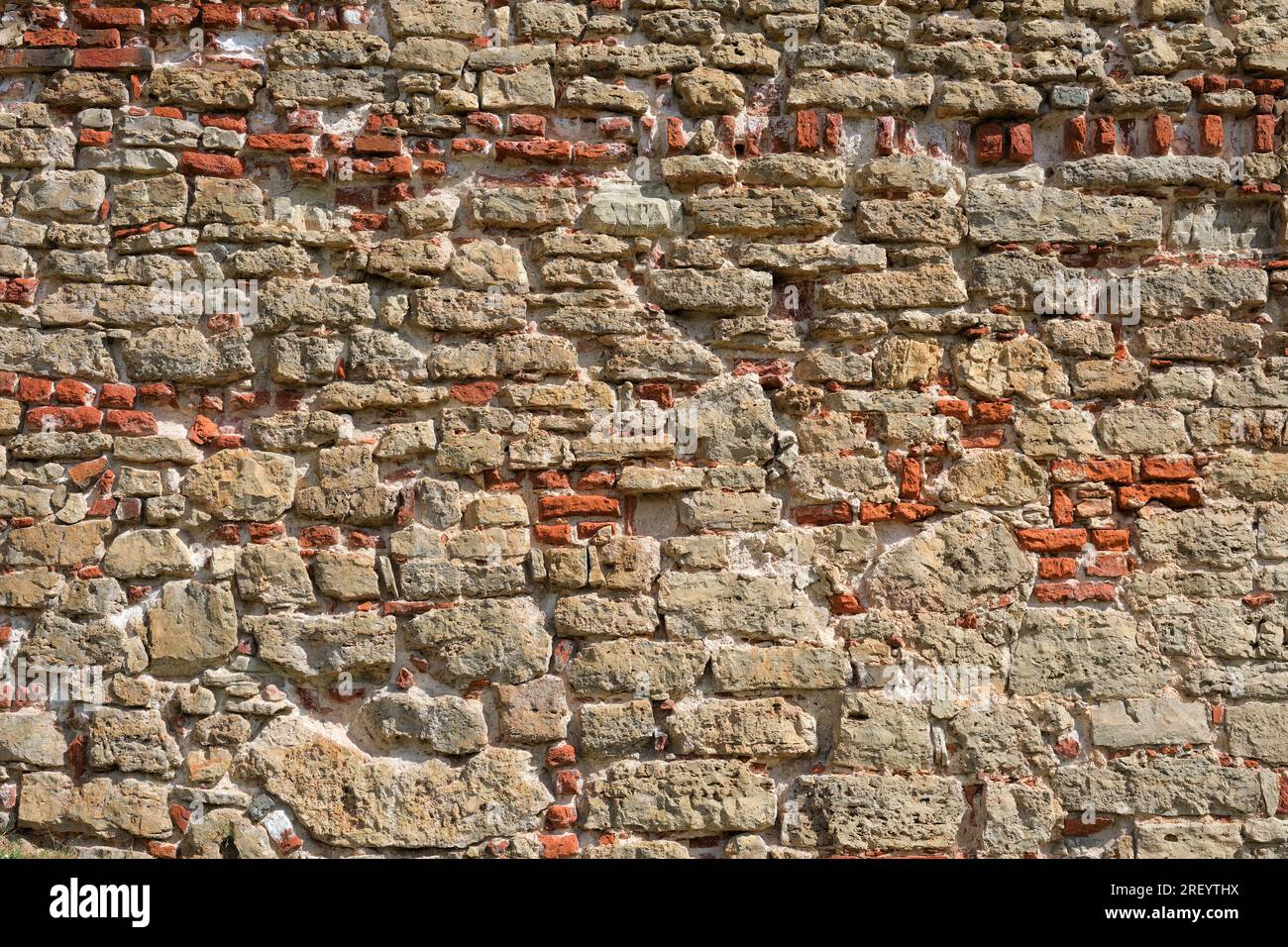 Vieux fond de mur de brique rouge. Texture d'un vieux mur de pierre antique. Fond Stonewall. Banque D'Images