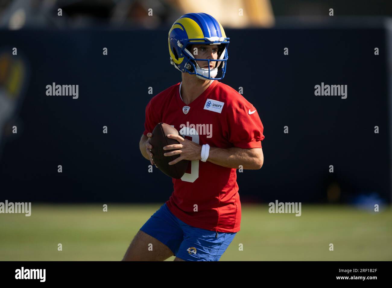 Los Angeles Rams quarterback Stetson Bennett (13) looks to throw a pass at the NFL football team's training camp, Saturday, July 29, 2023, in Irvine, Calif. (AP Photo/Kyusung Gong) Banque D'Images