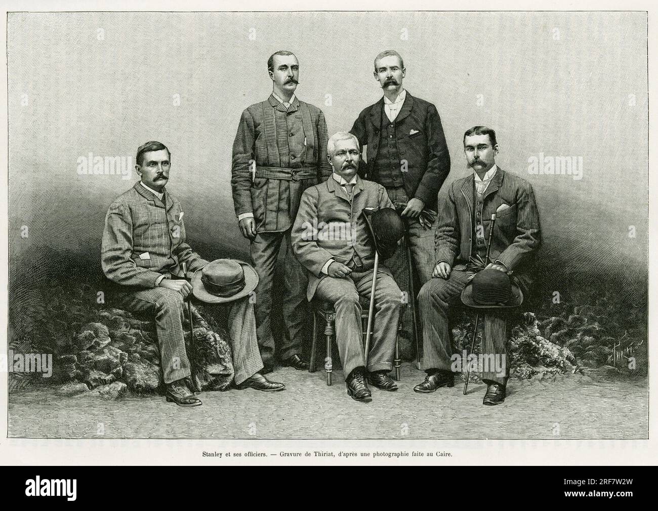 Portrait de Henry Morton Stanley ( ne John Rowlands 1841-1904) entourage de ses officiers, a partir de la gauche : Dr. Thomas Heazle Parke ( 1857-1893), Robert H. Nelson, William G. Stairs, et Arthur J. M. Jephson. Gravure de Thiriat, pour illustrer le recit dans les tenebres de l'Afrique, recherche découverte et retraite d'Emin Pacha, en 1887-1889, par Henry Stanley, dans le tour du monde 1890, sous la direction d'Edouard Charton ( 1807-1890), Hachette, Paris. Banque D'Images