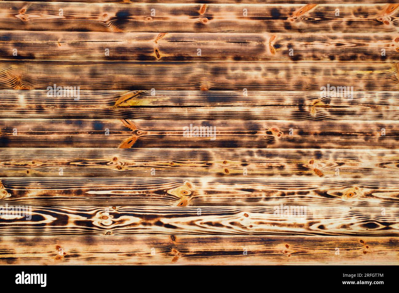 Texture des planches de bois brûlées. Planches de bois brunes brûlées. Texture du bois Banque D'Images