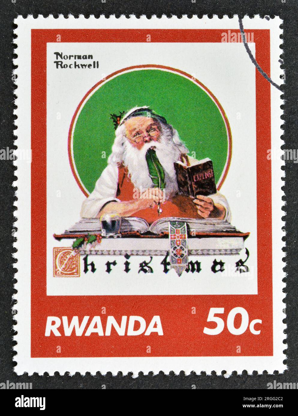 Timbre-poste annulé imprimé par le Rwanda, qui montre une peinture de Norman Rockwell, Noël, vers 1981. Banque D'Images