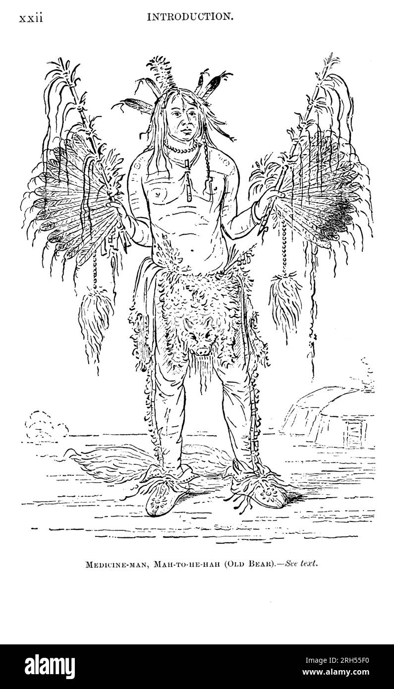 Medicine Man, Mah-to-he-Hah (Old Bear) Indian portant des vêtements et des ustensiles tirés du livre ' The Song of Hiawatha ' de Longfellow, Henry Wadsworth, 1807-1882 publié par Mifflin and Company en 1898 Banque D'Images
