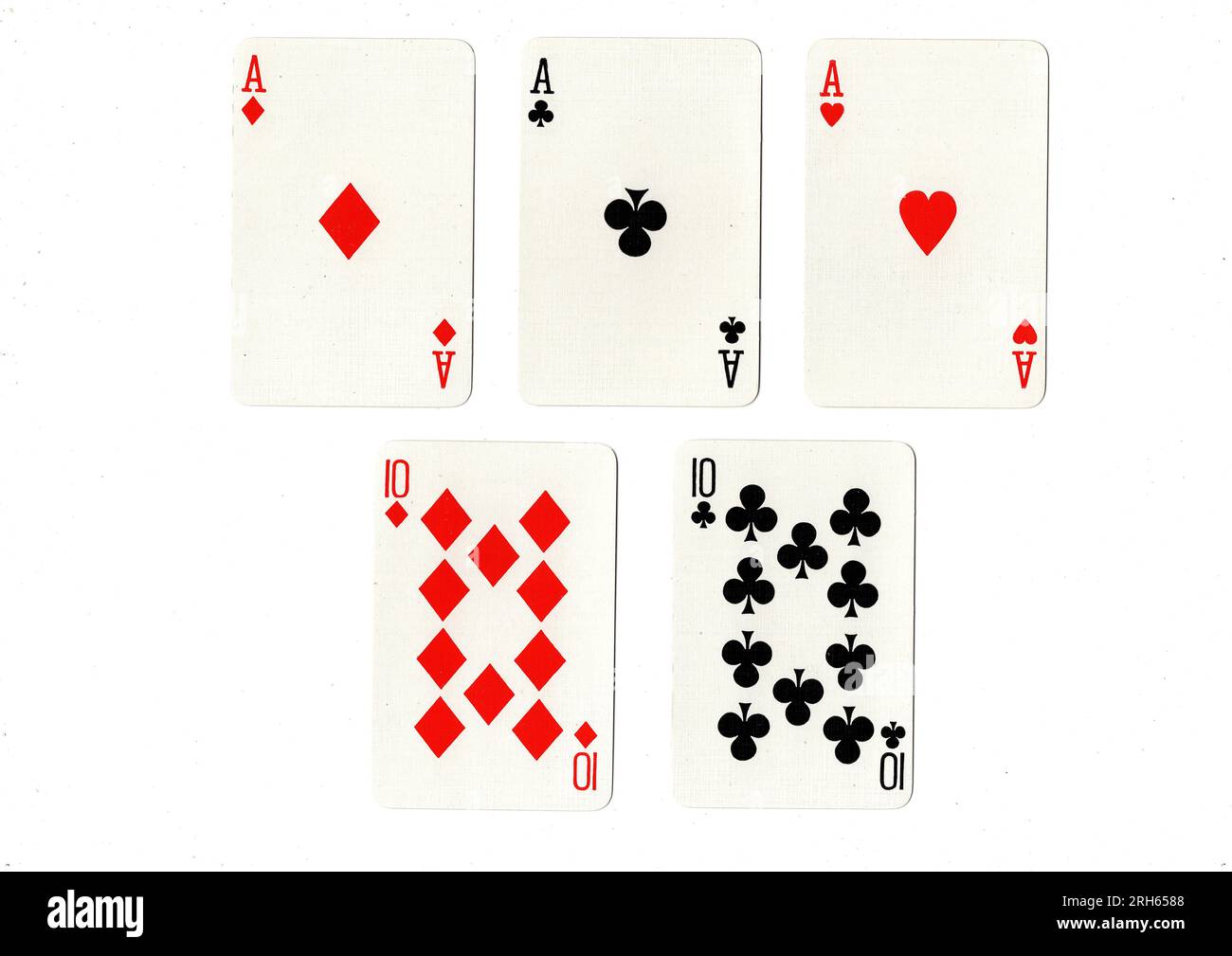 Une main de poker de cartes à jouer montrant une maison pleine d'as sur des dizaines. Banque D'Images