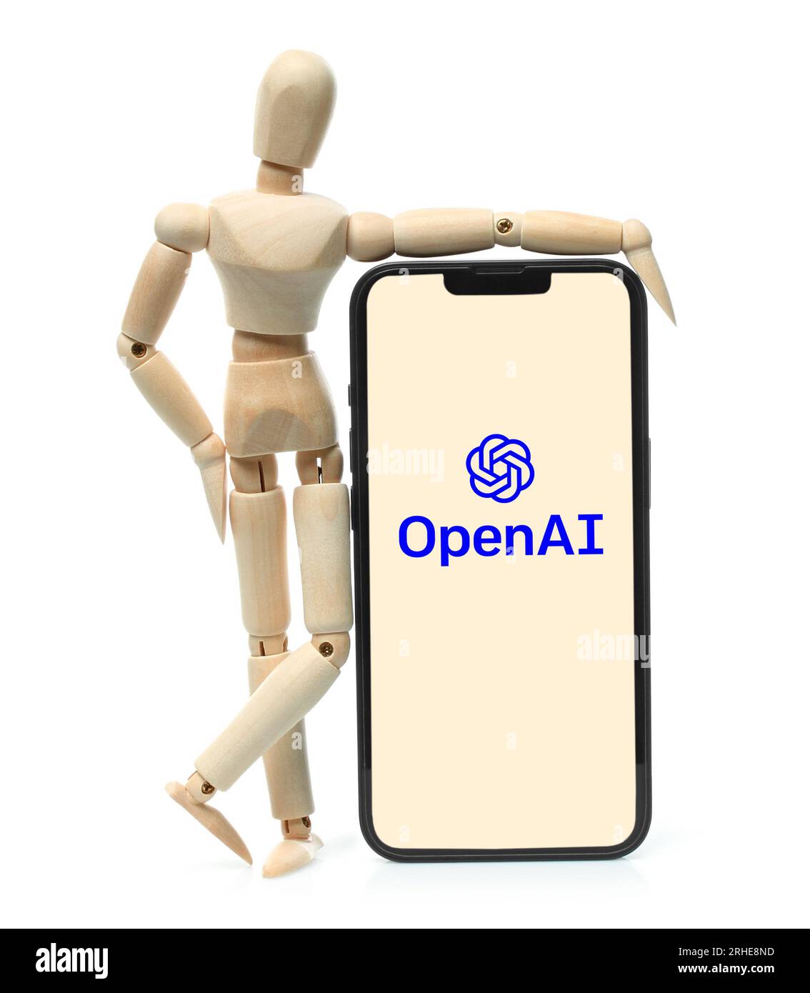Kiev, Ukraine - 08 mars 2023 : logo OpenAI sur l'écran du téléphone avec mannequin en bois. OpenAI est un organisme de recherche en intelligence artificielle à but non lucratif Banque D'Images