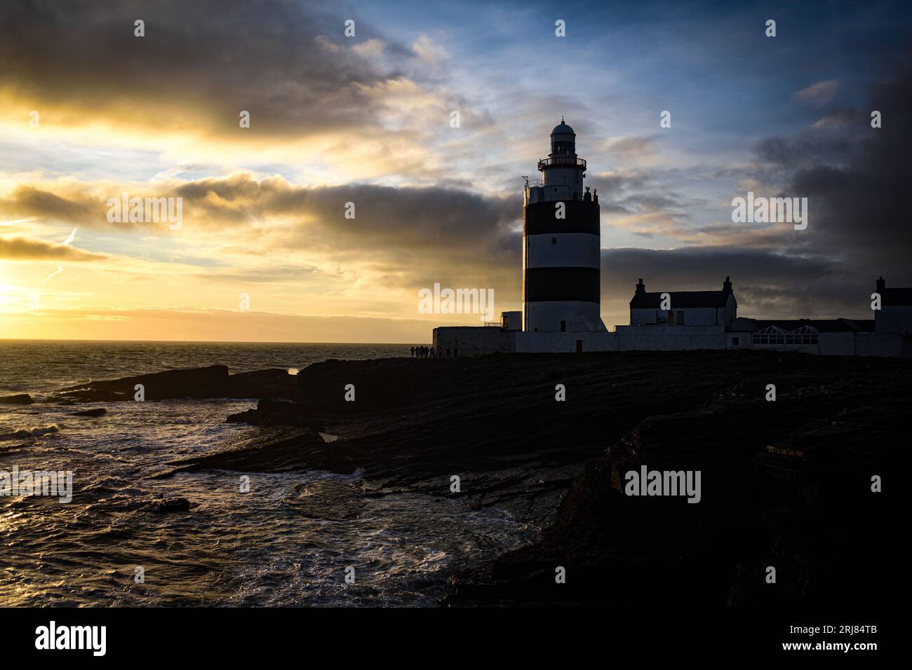 Coucher de soleil au phare de Hook, Co. Wexford, Irlande Banque D'Images