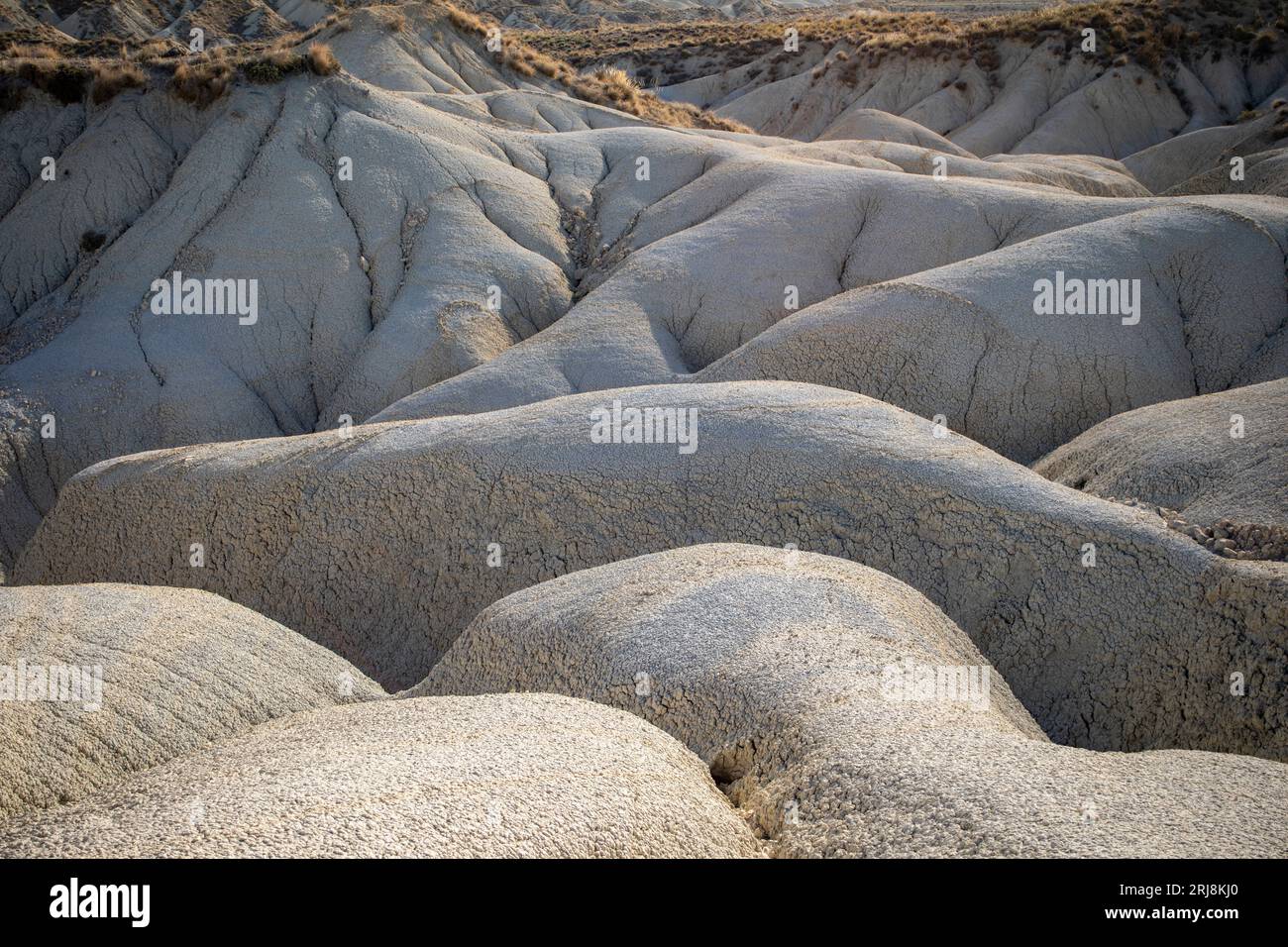 Photographie horizontale du paysage aride et désertique sinueux des badlands du désert d'Abanilla, Murcie, Espagne Banque D'Images