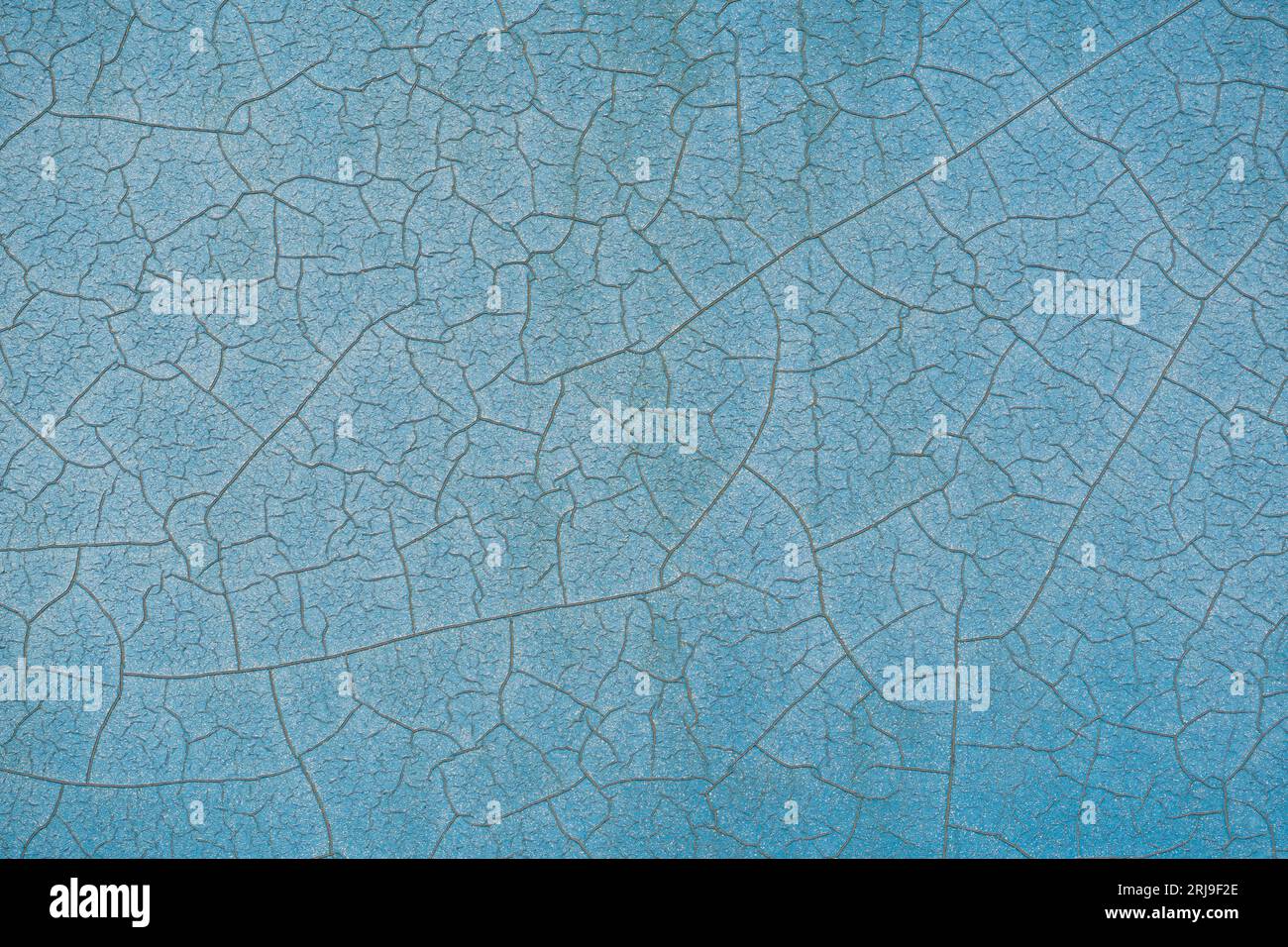Fond de texture de mur peint en bleu craqué Banque D'Images