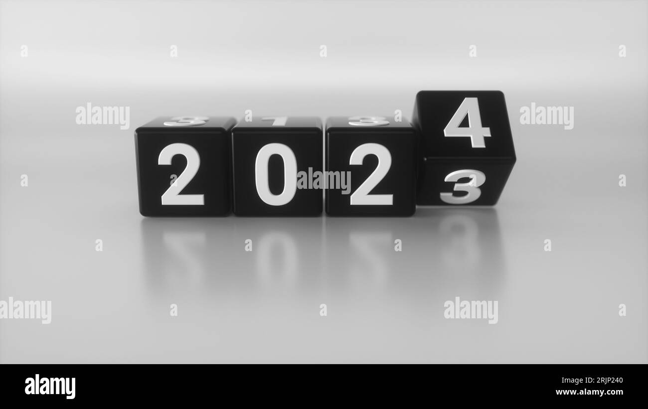 Une pile de trois blocs de couleurs différentes avec un numéro 2023 changeant en 2024 isolé sur un fond blanc Banque D'Images