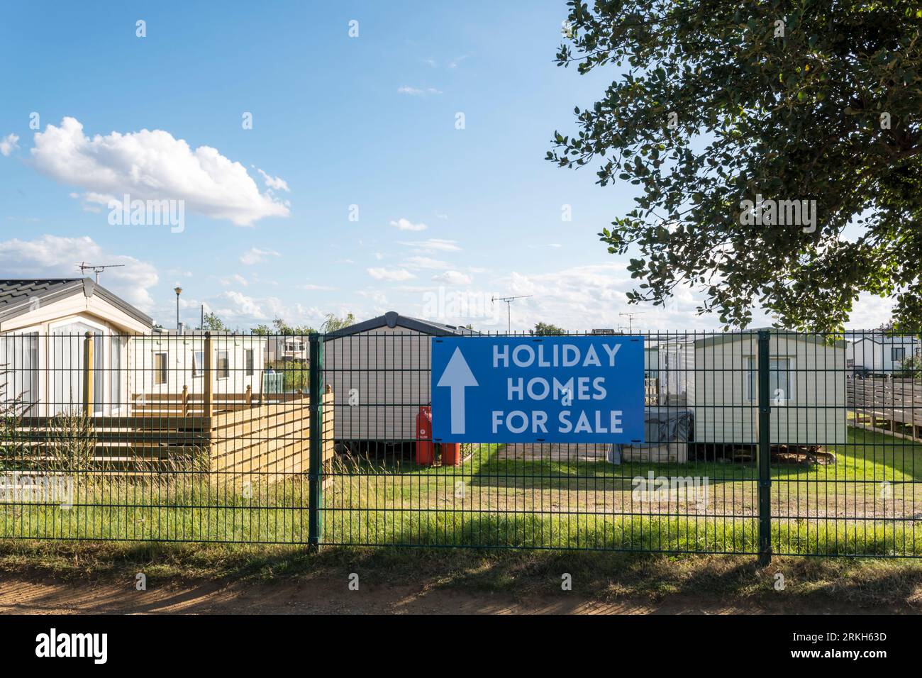 Panneau de maisons de vacances à vendre à un parc de caravanes sur la côte de Norfolk. Banque D'Images