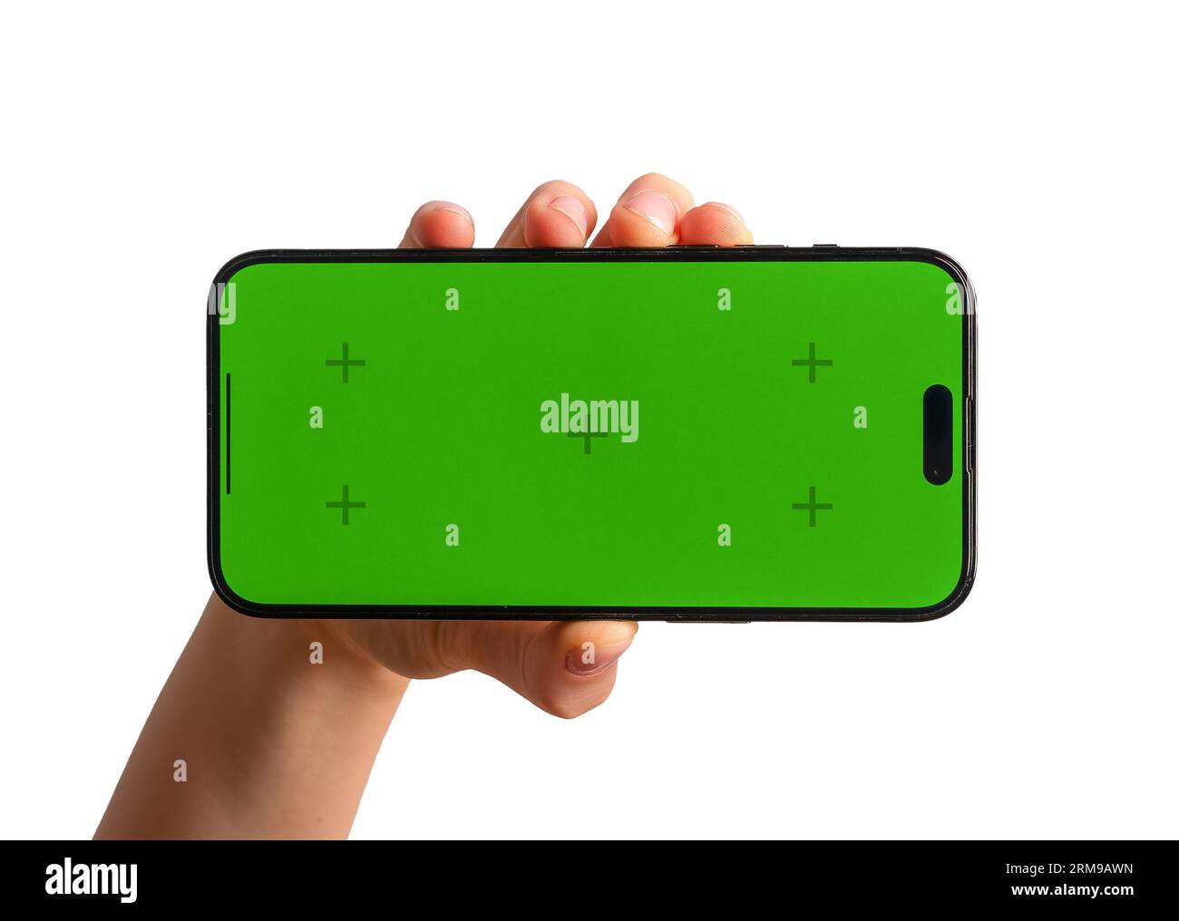 Main tenant l'écran vert horizontal, maquette de téléphone portable isolé sur fond blanc. Banque D'Images