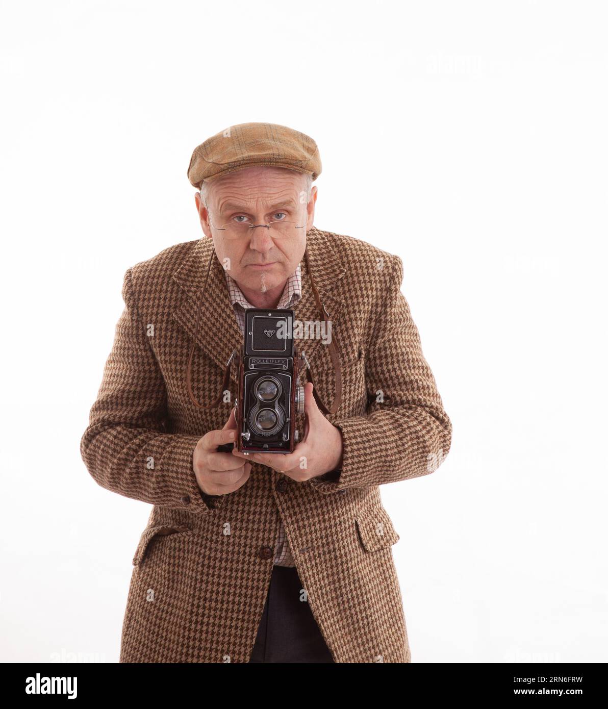Un photographe anglais mature dans tweeds classique Banque D'Images
