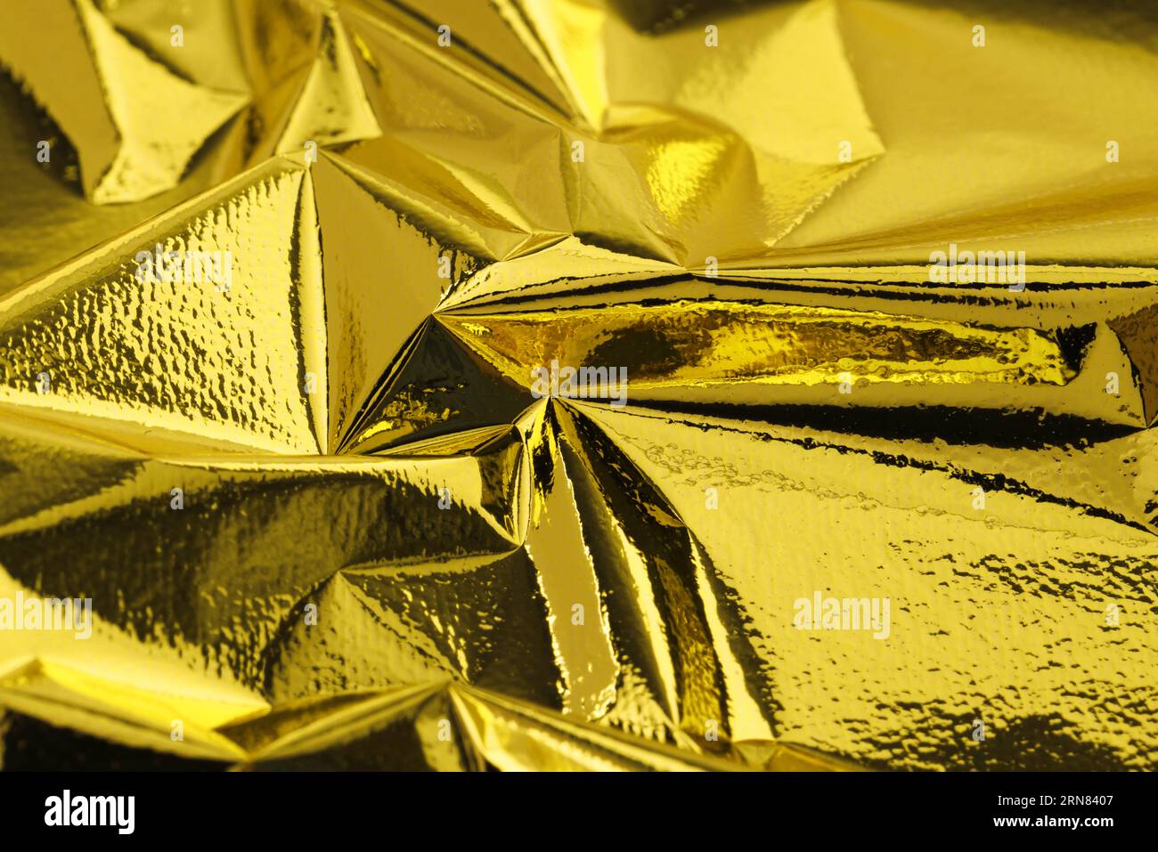 Feuille de feuille d'or comestible comme fond, gros plan Banque D'Images