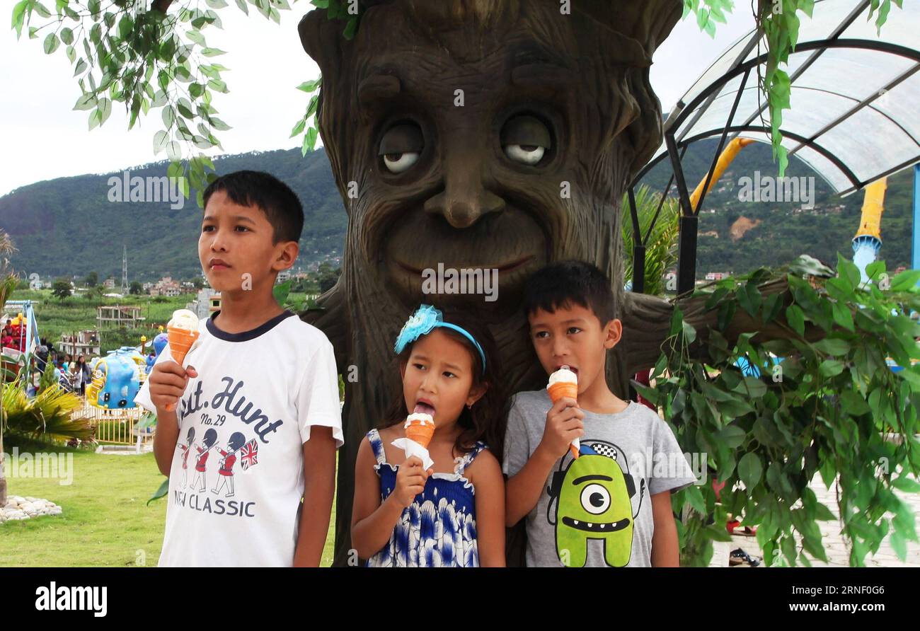 (160710) -- KATHMANDU, July 10, 2016 -- Nepalese kids enjoy ice-creams in front of the fun-tree at the newly-opened Whoopee Land Amusement and Water Park in Chobhar, on the outskirts of Kathmandu, capital of Nepal, July 10, 2016. ) NEPAL-KATHMANDU-WHOOPEE LAND AMUSEMENT AND WATER PARK SunilxSharma PUBLICATIONxNOTxINxCHN   160710 Kathmandu July 10 2016 Nepalese Kids Enjoy ICE Creams in Front of The Fun Tree AT The newly opened Whoopee Country Amusement and Water Park in Chobhar ON The outskirts of Kathmandu Capital of Nepal July 10 2016 Nepal Kathmandu Whoopee Country Amusement and Water Park S Banque D'Images